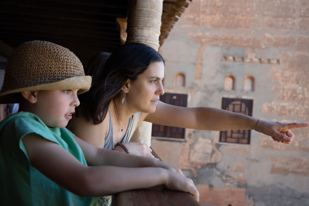 mother-and-son-exploring-ancient-ruins-pointing-a-2026-01-09-10-06-37-utc