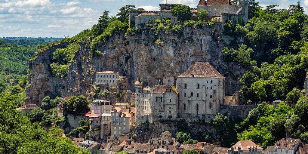 Rocamadour in the Lot department in southwestern France. Rocamadour has attracted visitors for its setting in a gorge above a tributary of the River Dordogne, and for its sanctuary of the Blessed Virgin Mary, which for centuries has attracted pilgrims from many countries.